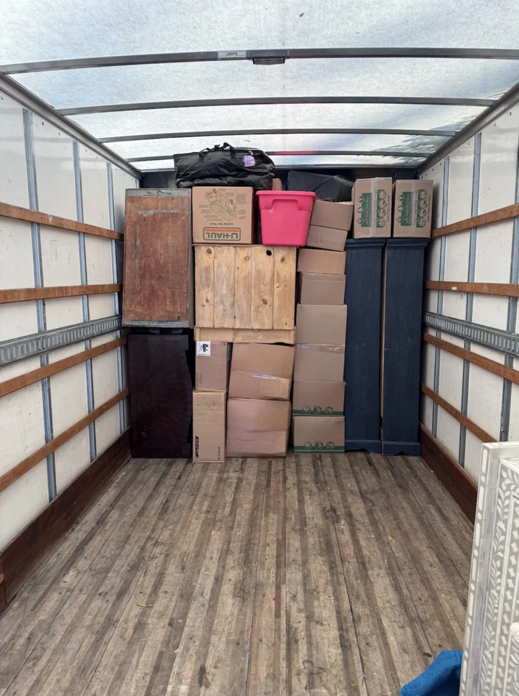 Moving truck organized with boxes and furniture packed securely for transport