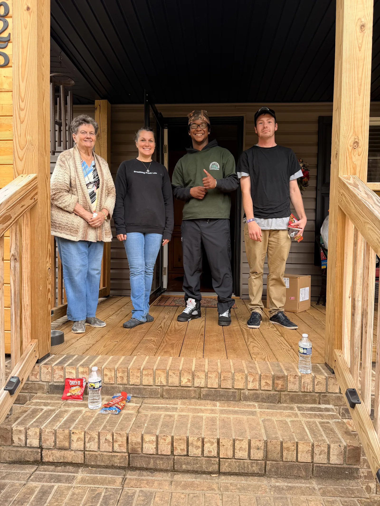 Carter's Moving crew with customers after completing a residential move