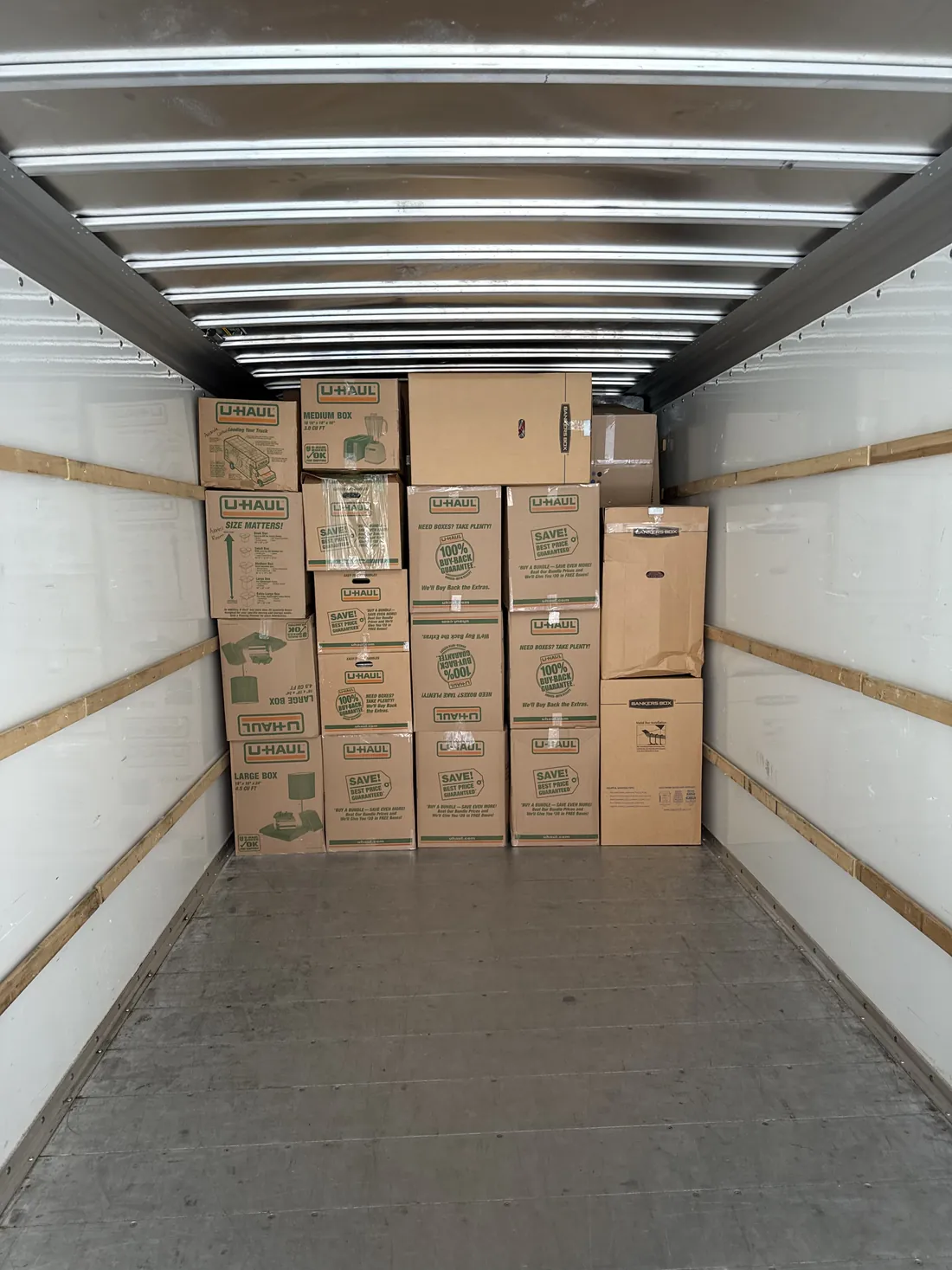 Household boxes packed and organized inside a moving truck for a Greenville move